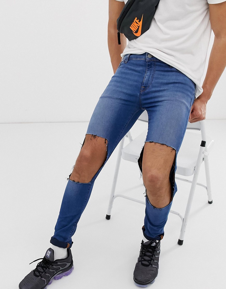 ASOS DESIGN super spray on jeans in mid blue with open rips