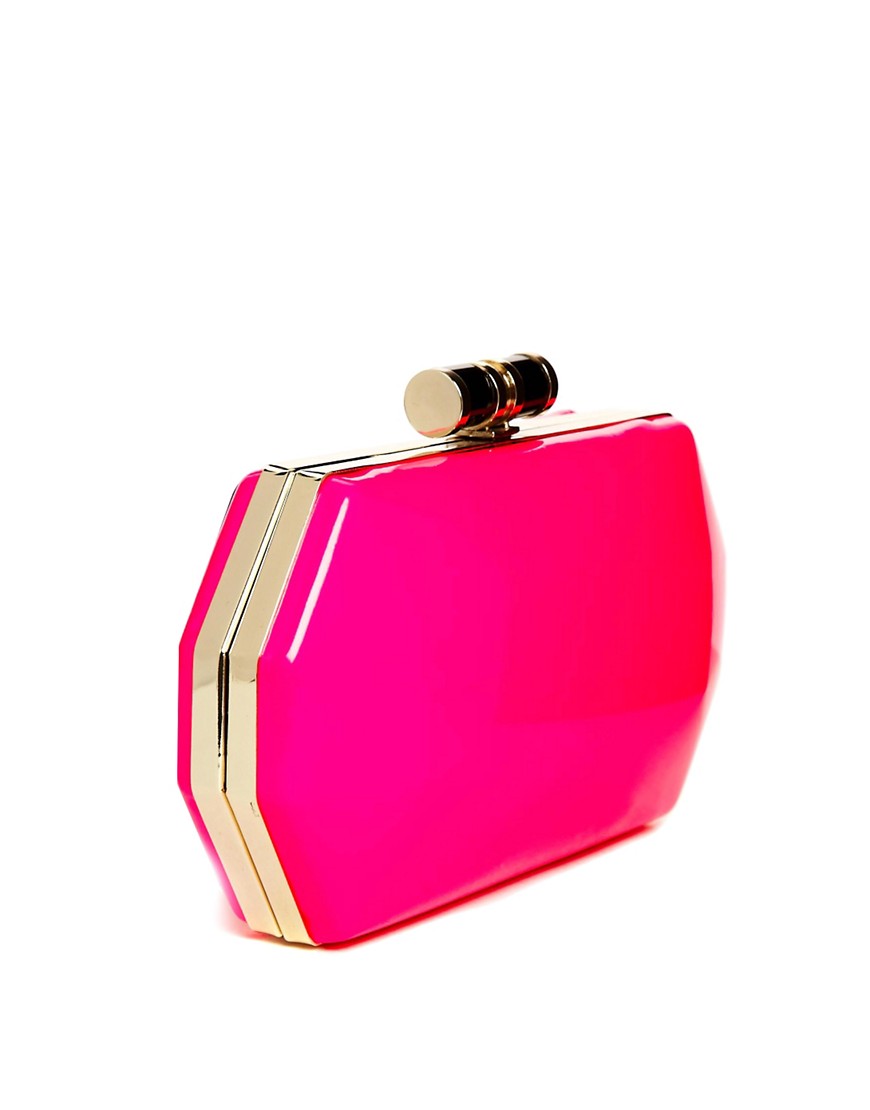 Pink | Liquorish Hard Shell Neon Pink Clutch Bag at ASOS