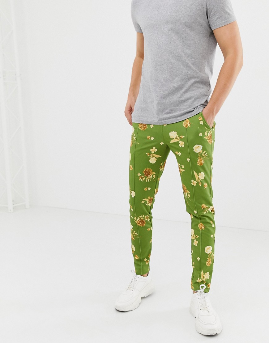 ASOS DESIGN skinny joggers in retro track fabric with floral print in green