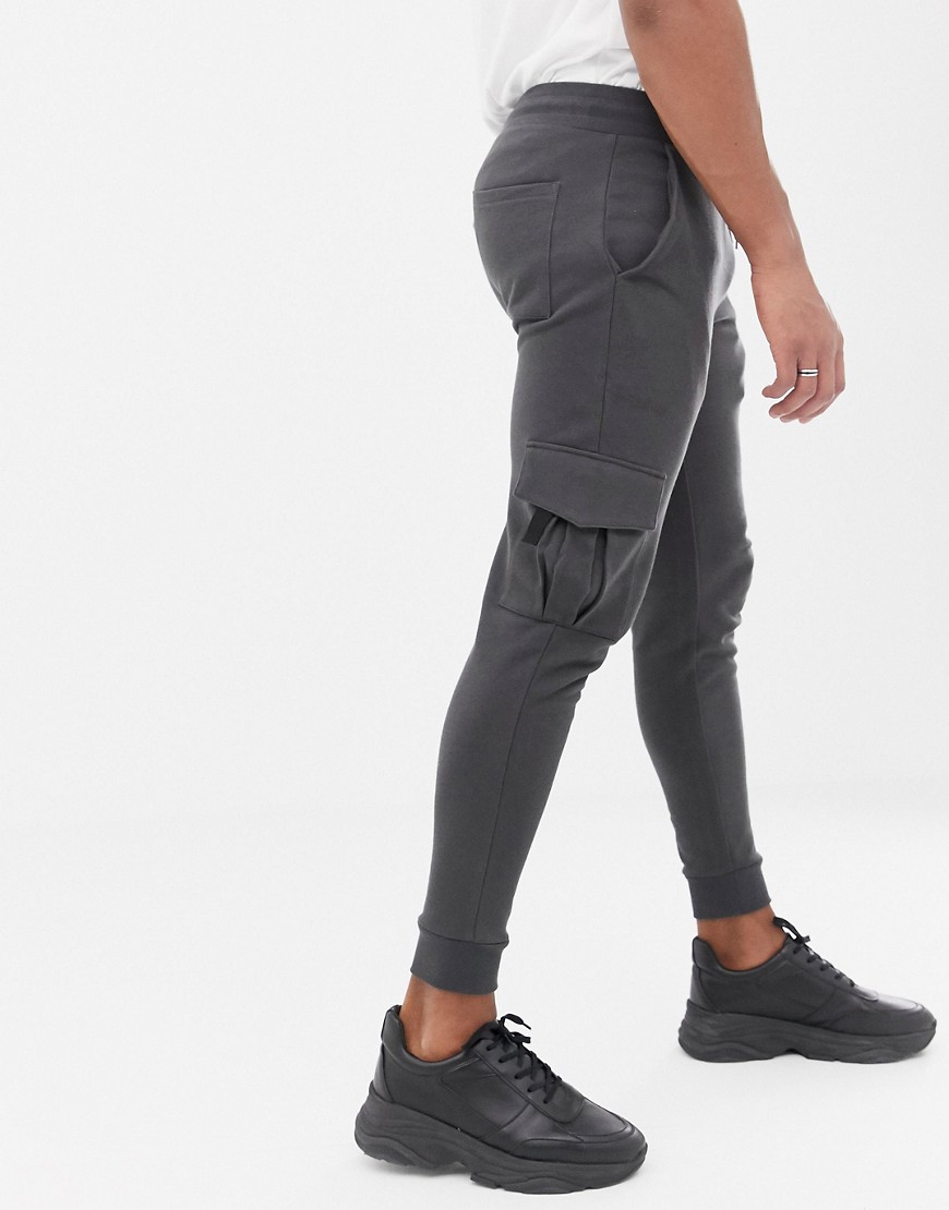 ASOS DESIGN skinny joggers with cargo pocket in washed black
