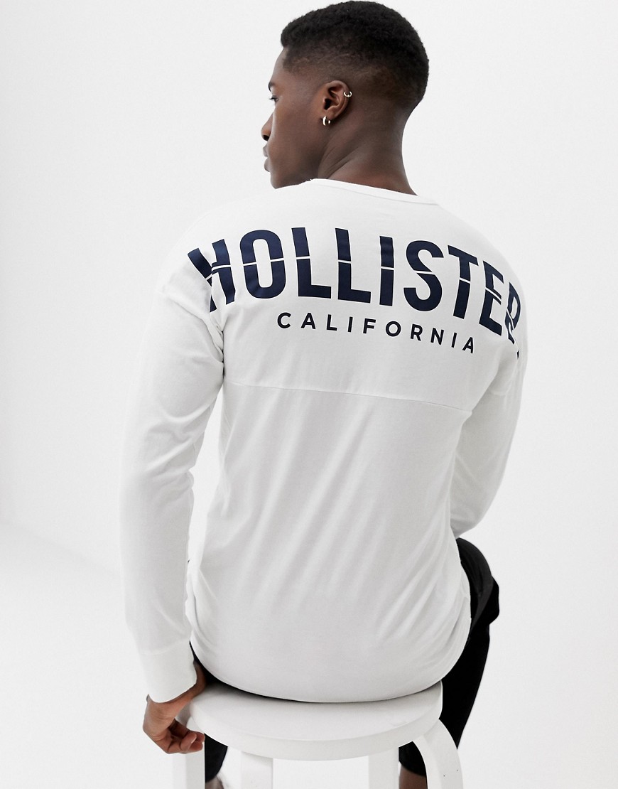 Hollister crew neck long sleeve top with back graphic logo in white