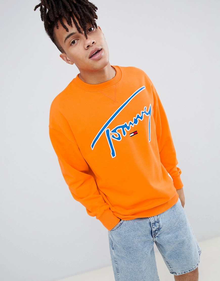 Tommy Jeans Signature Capsule logo front sweatshirt relaxed fit in orange - Orange peel