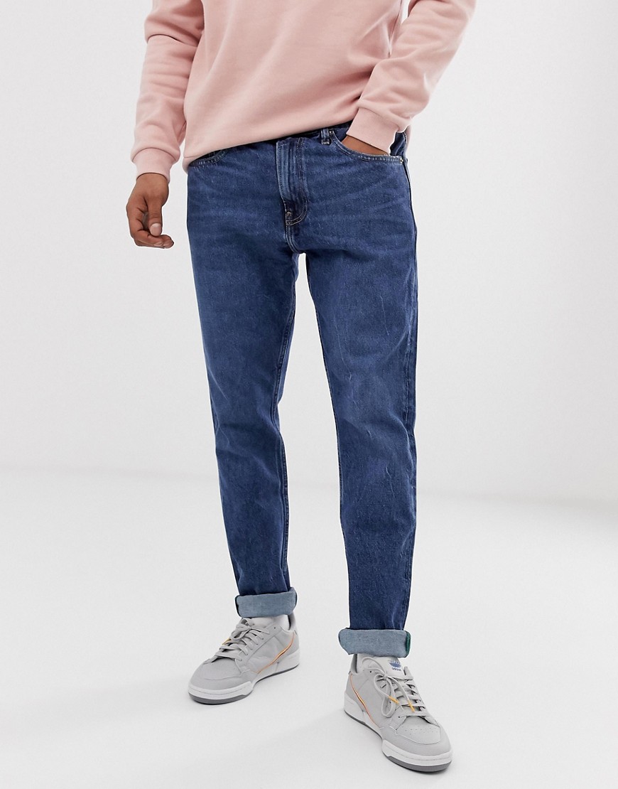 Tommy Jeans mordern tapered jeans in mid wash