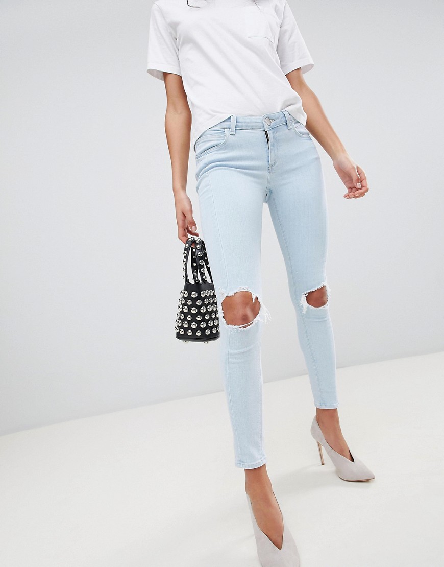 Asos Design Whitby Low Rise Skinny Jeans In Philomena Light Ice Stone Wash With Busted Knees - Blue