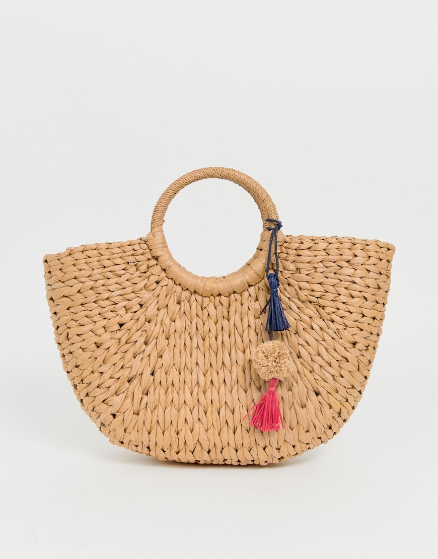 Hat Attack cresent straw basket with pom