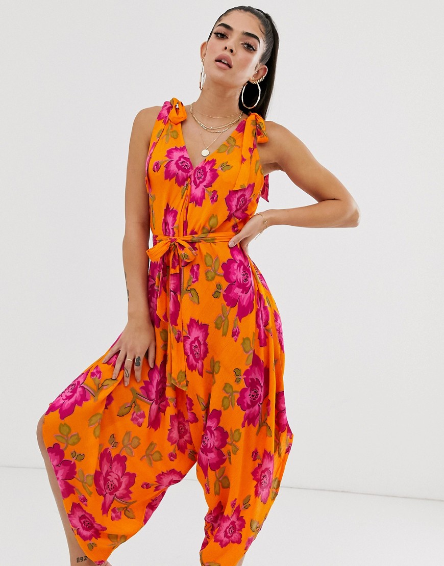 ASOS DESIGN tie shoulder harem beach jumpsuit in bold floral print
