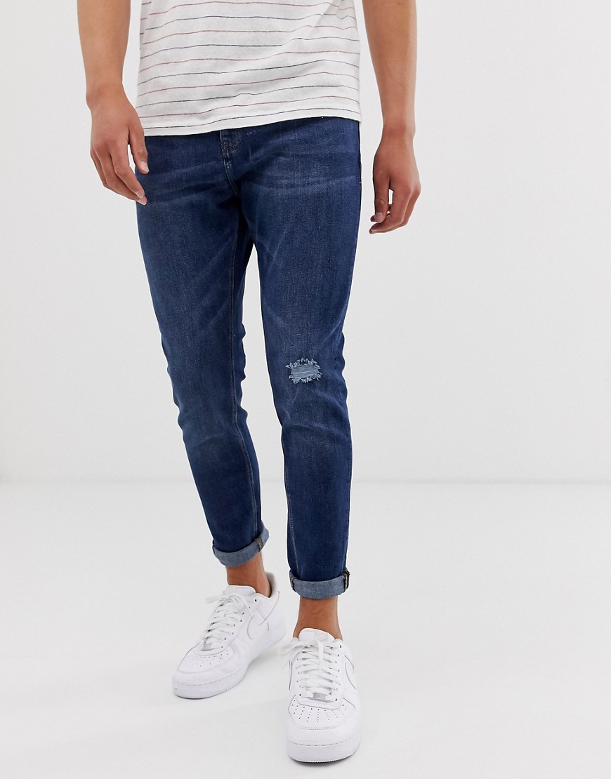 Pull&Bear tapered carrot fit jeans in dark blue with ripped knee