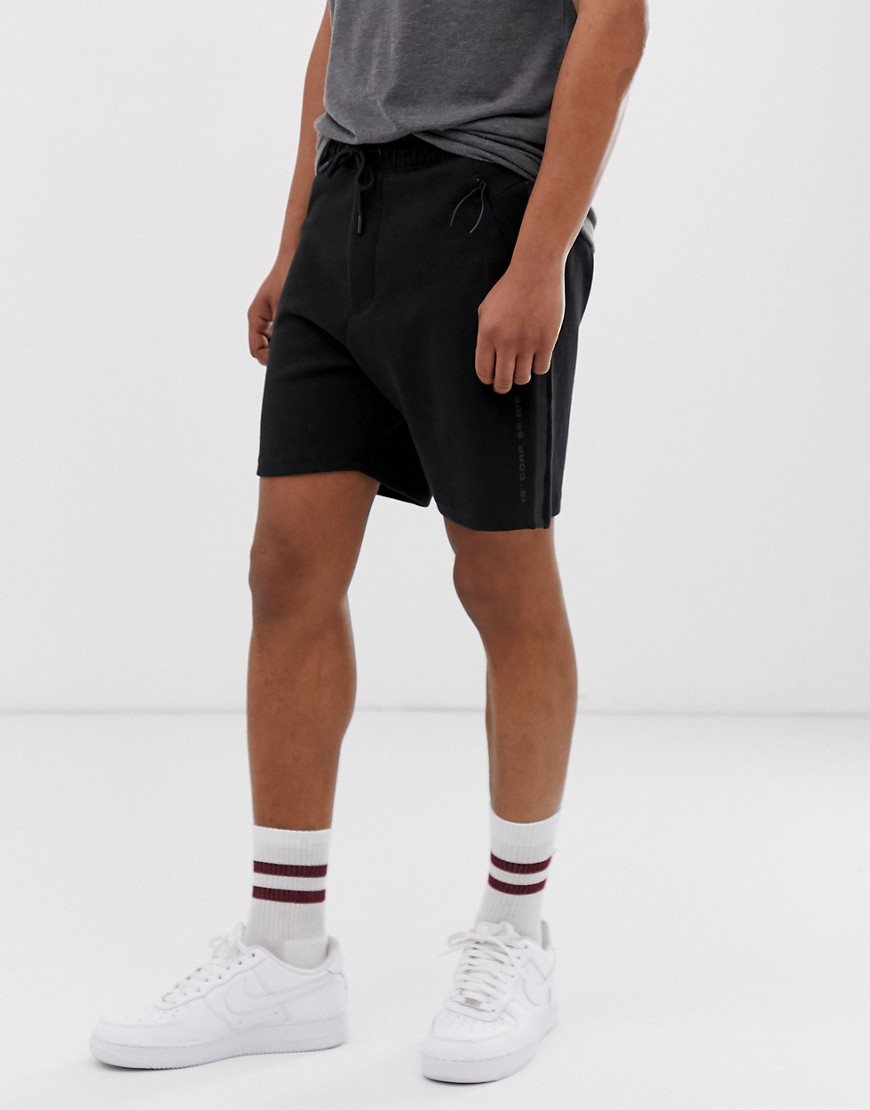 Bershka jogger shorts with side taping in black