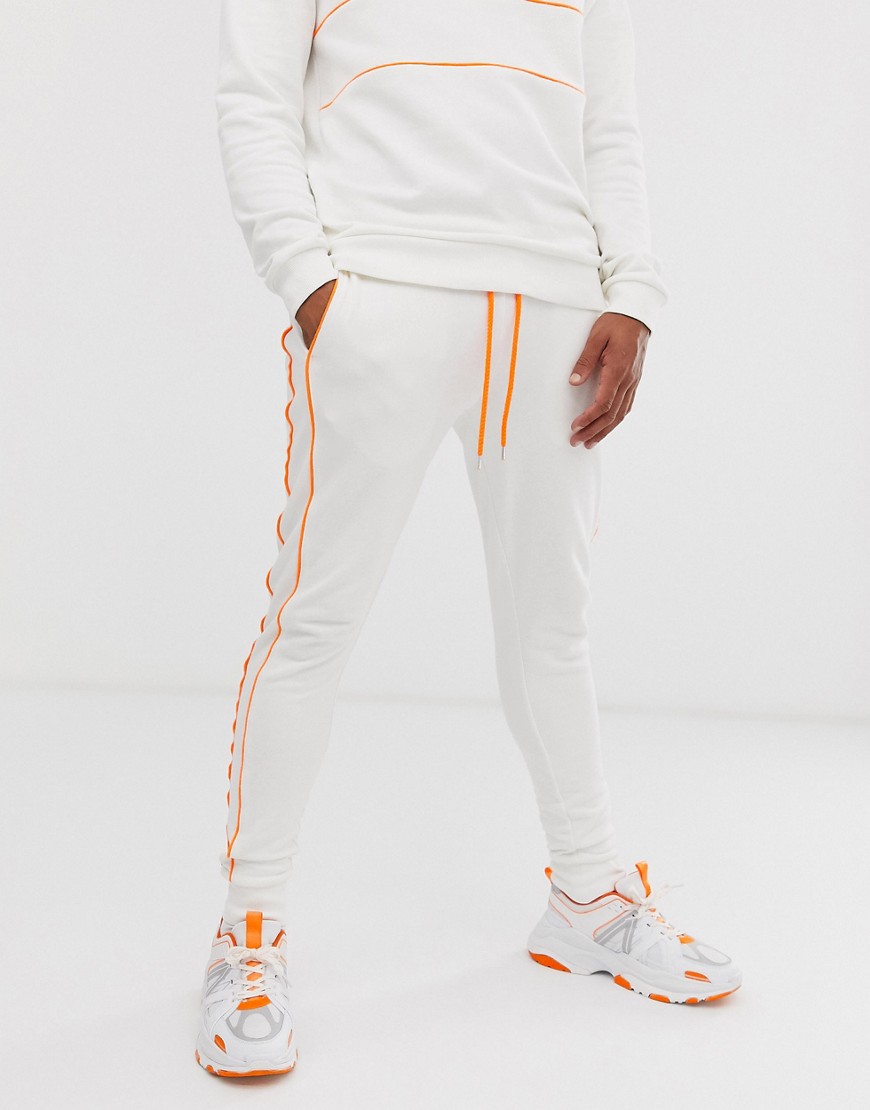 ASOS DESIGN co-ord skinny joggers with neon piping in white