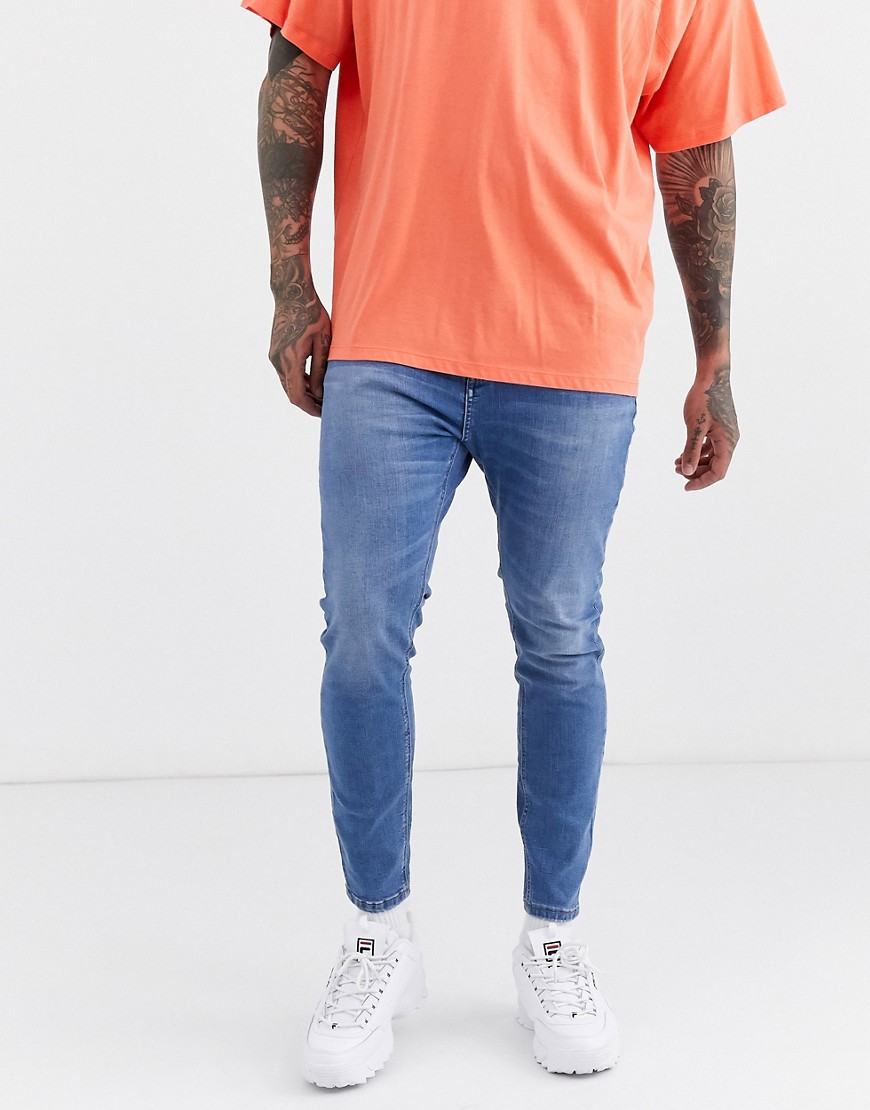 Pull&Bear Join Life tapered carrot fit jeans in blue wash