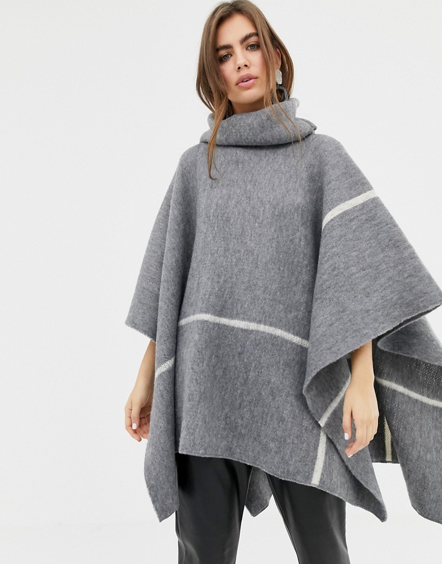 b.Young roll neck poncho