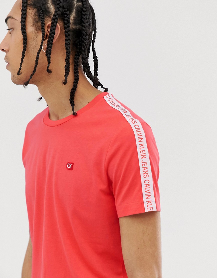 Calvin Klein Jeans institutional tape sleeve logo t-shirt in coral