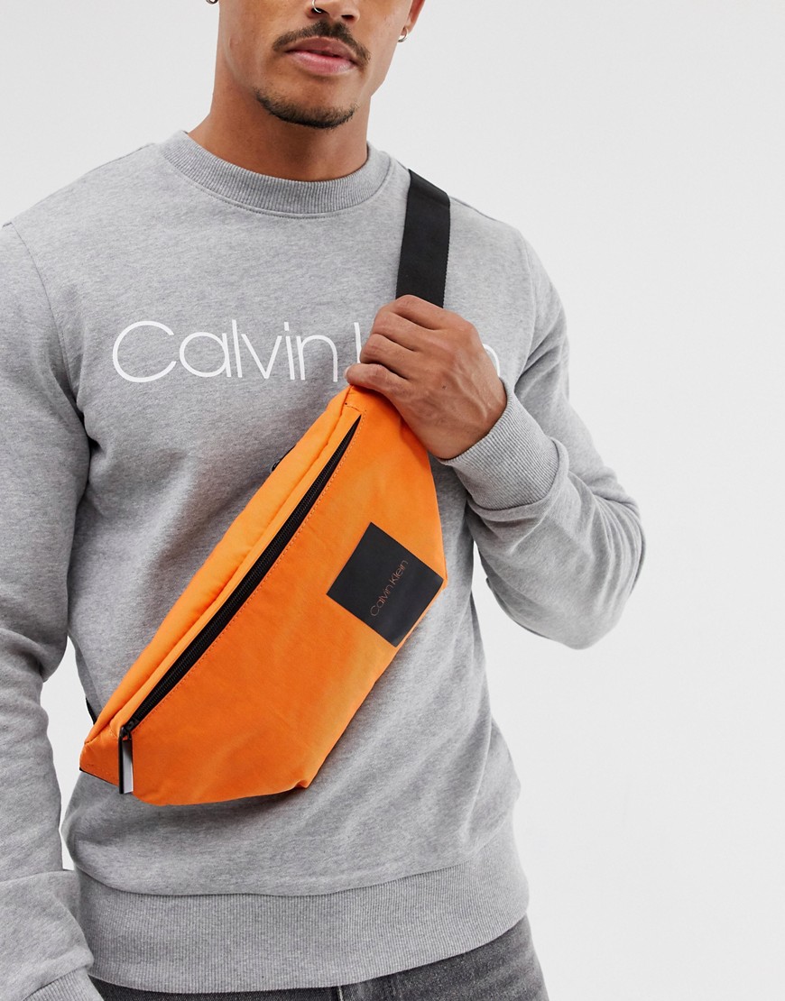 Calvin Klein Item Story logo bum bag in orange