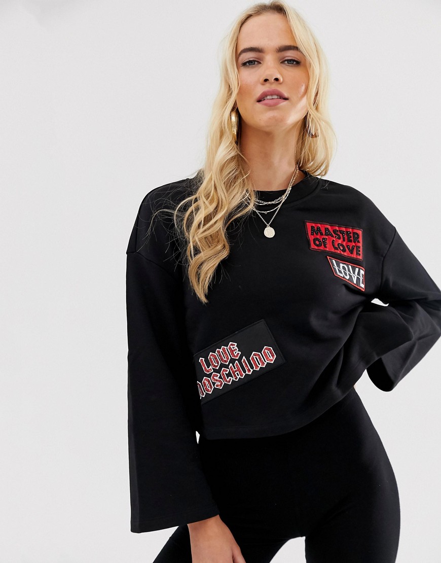 Love Moschino master of love patches flared sleeve sweatshirt