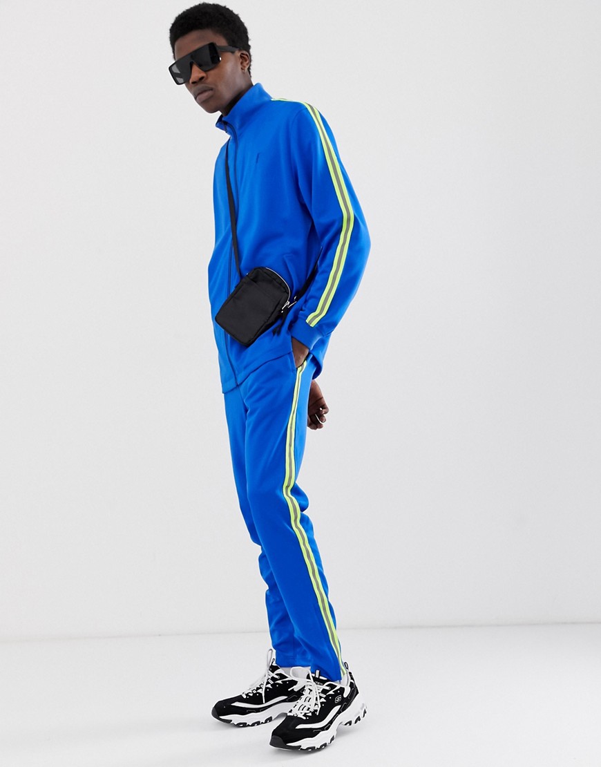 Fairplay Kiran track jogger with neon side stripe in blue