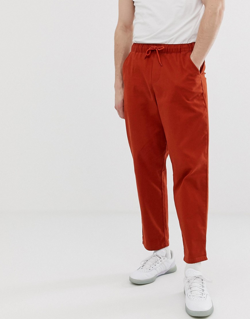 ASOS DESIGN relaxed chinos with elastic waist in rust