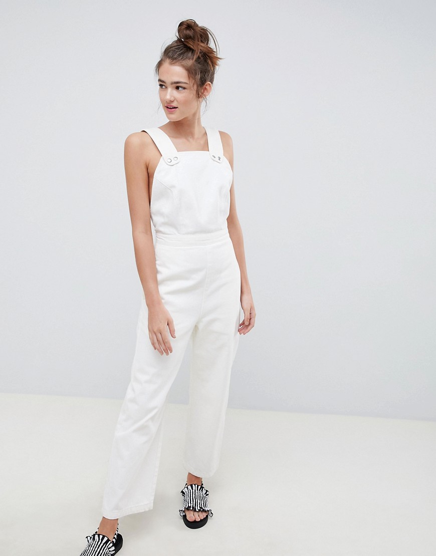 ASOS DESIGN denim jumpsuit in white with popper detail