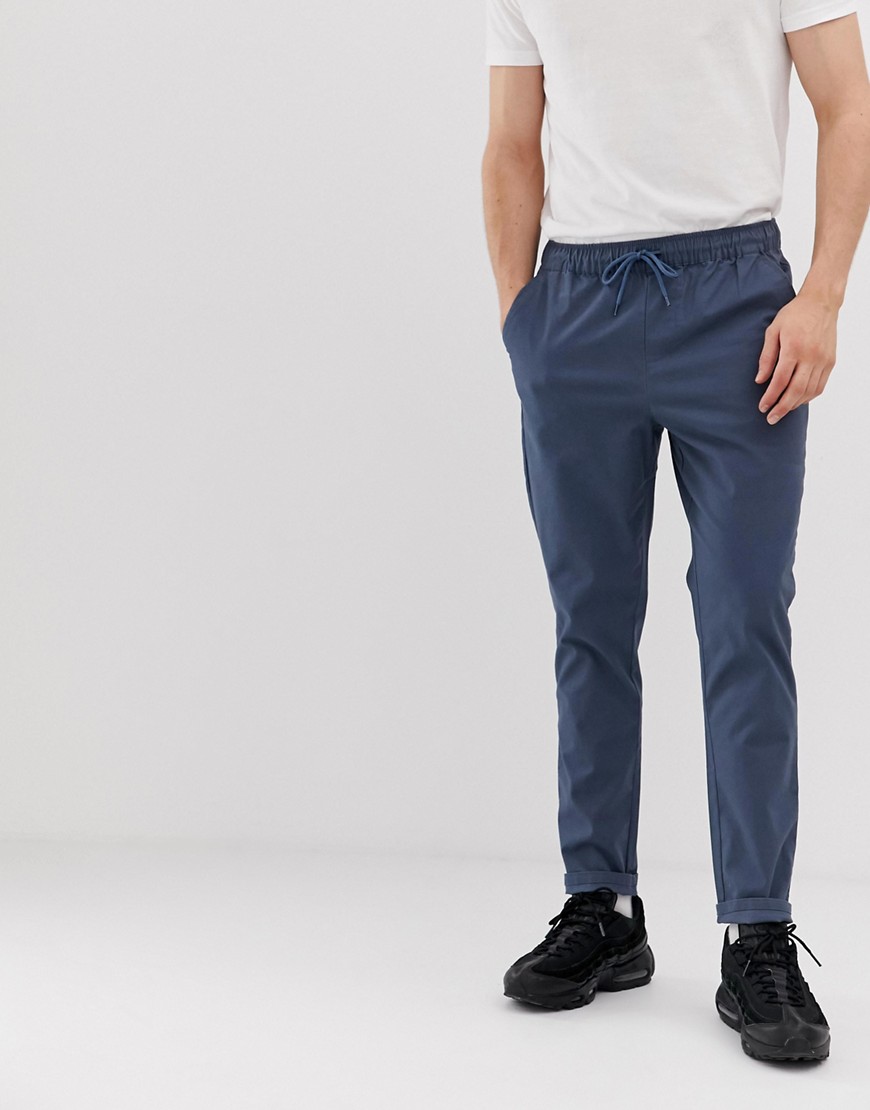 ASOS DESIGN tapered chinos in dark blue with elastic waist