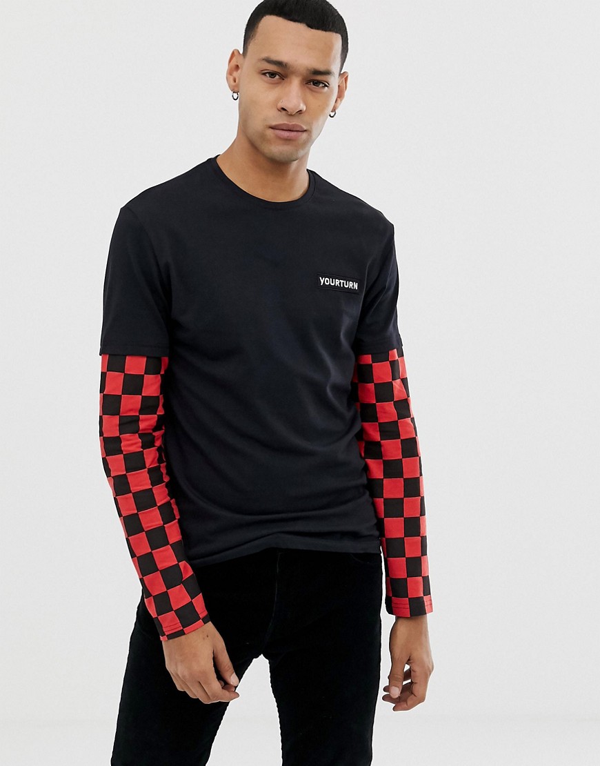 YOURTURN long sleeve top in black with red checkerboard sleeves