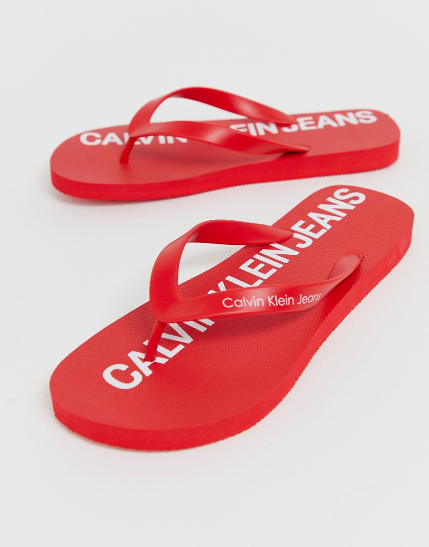 Calvin Klein Errol logo flip flops in red