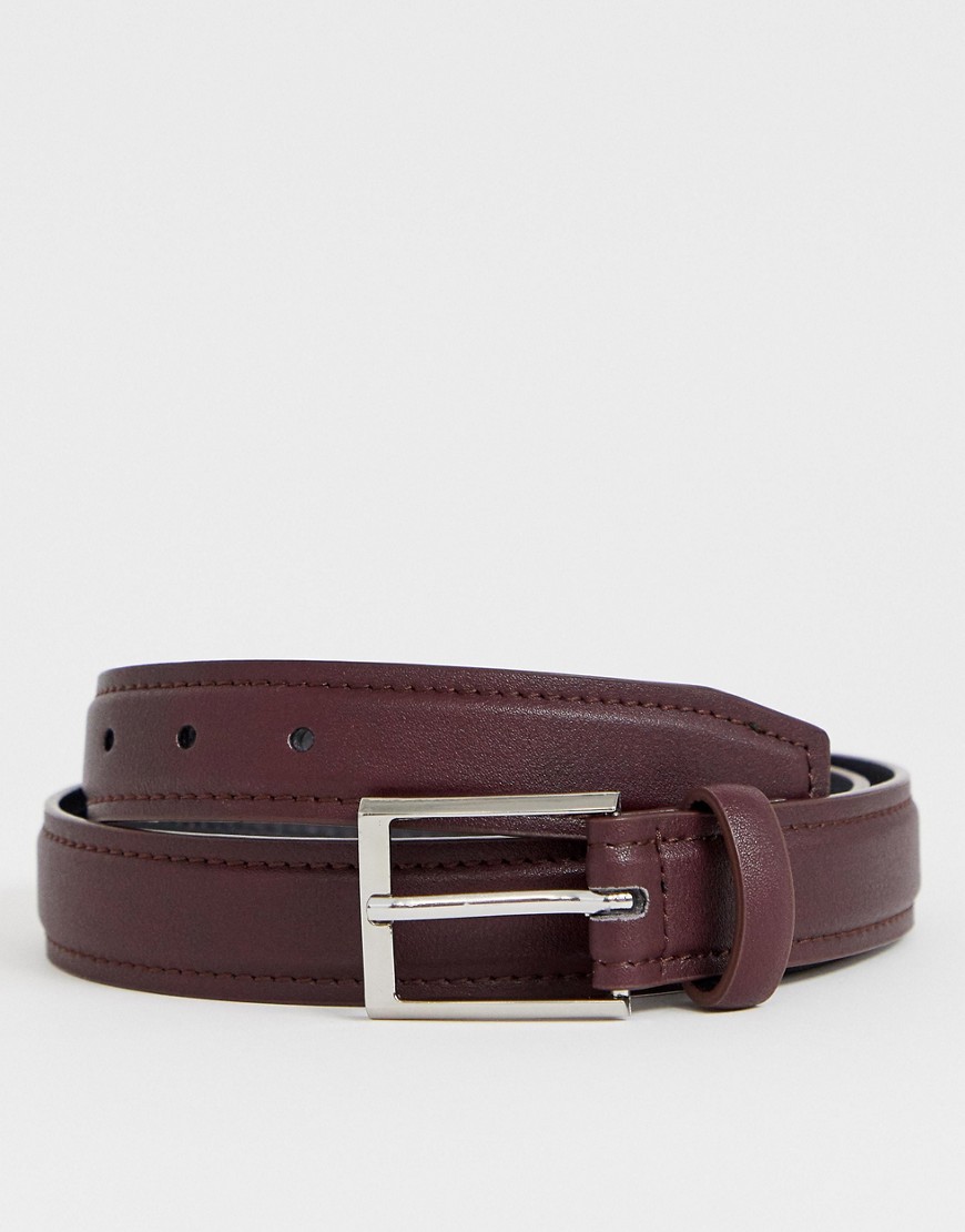ASOS DESIGN faux leather slim belt in burgundy with edge stitch