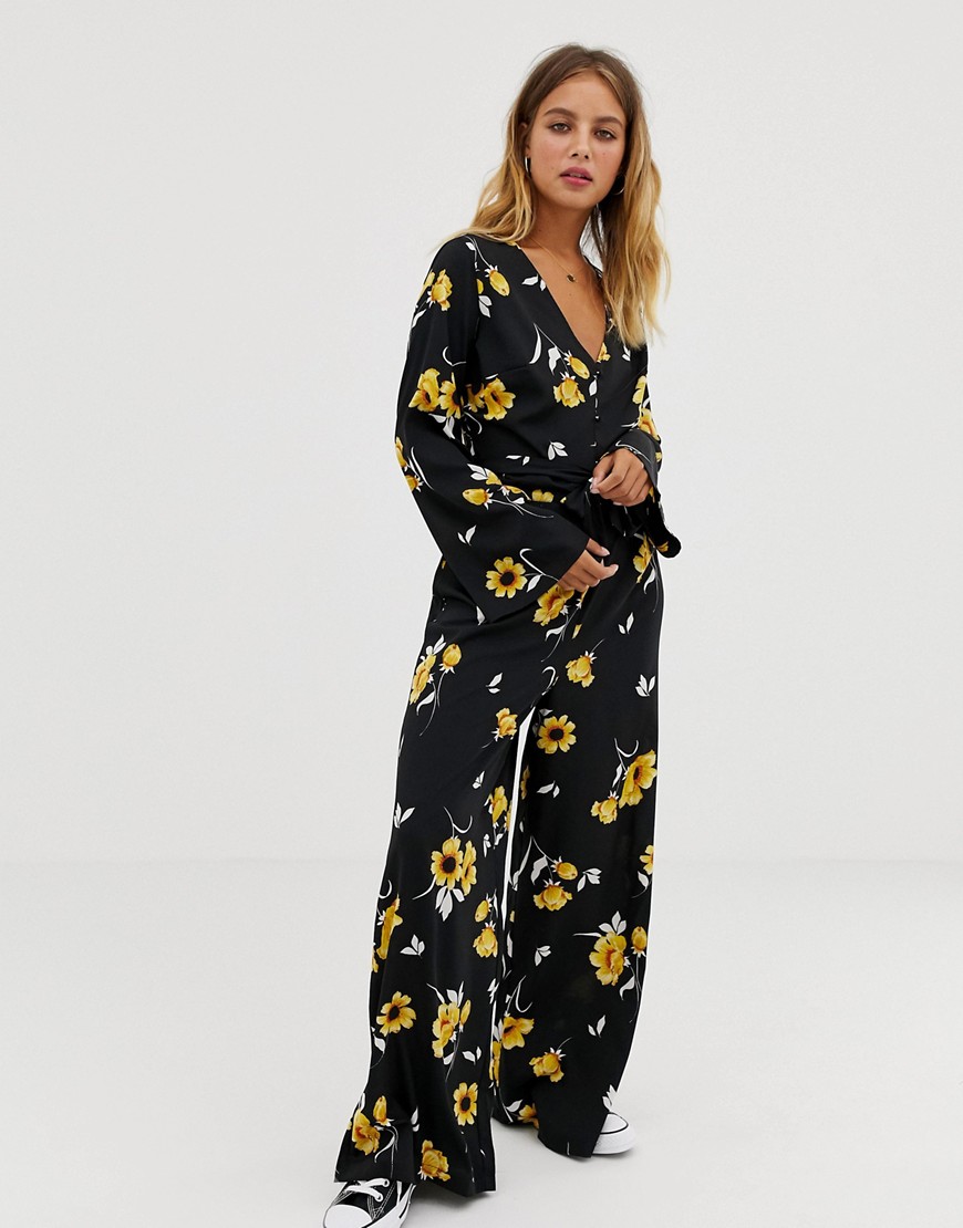 Influence flared sleeve button detail wide leg jumpsuit in floral print