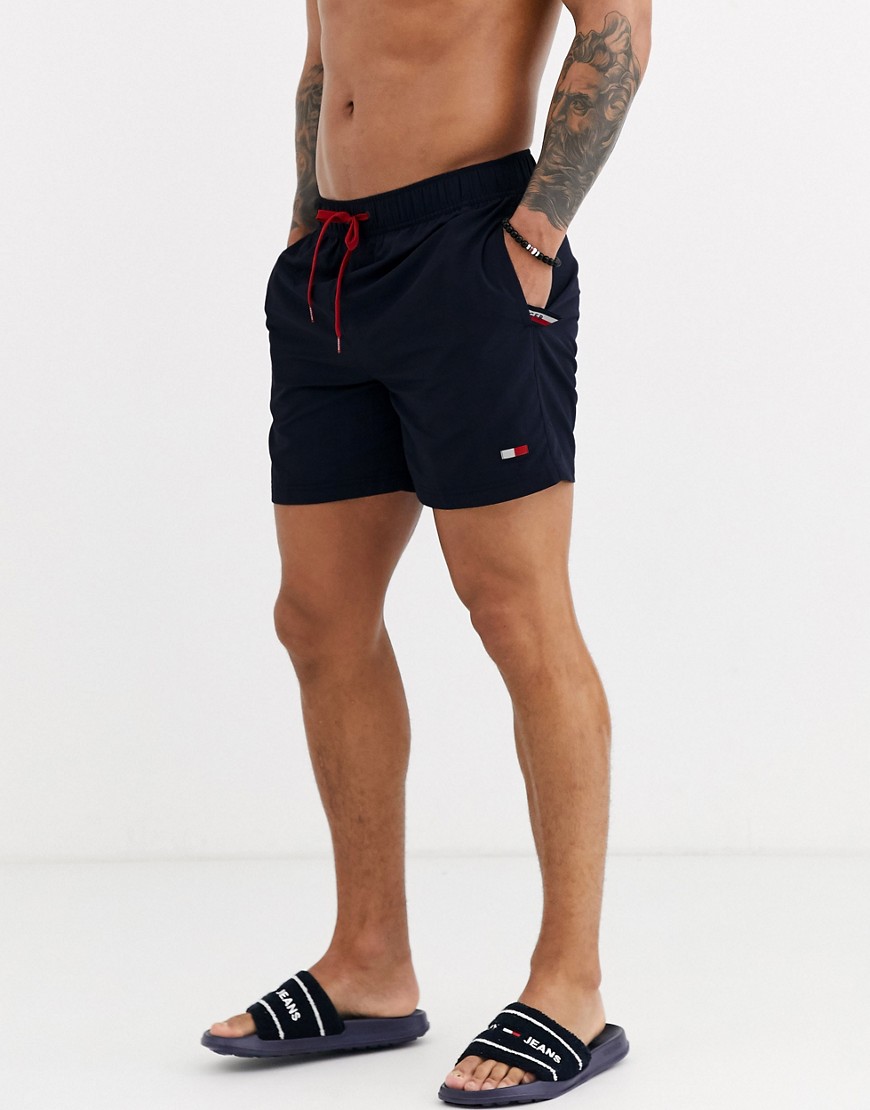 Tommy Hilfiger medium length small flag logo swim shorts in navy