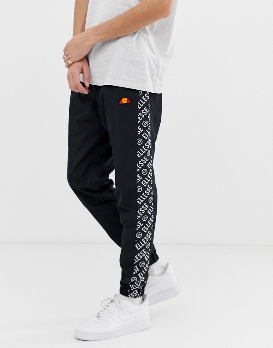 ellesse Fele co-ord track joggers with repeat logo side stripe in black