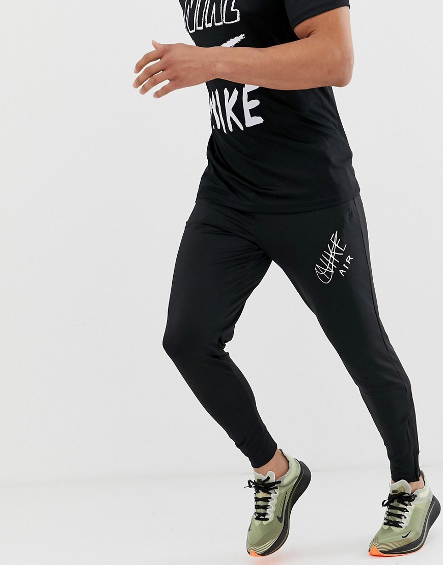 Nike Running swoosh print tapered joggers in black