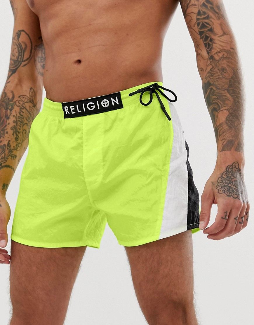 Religion swimshorts with cut and sew panels in neon yellow