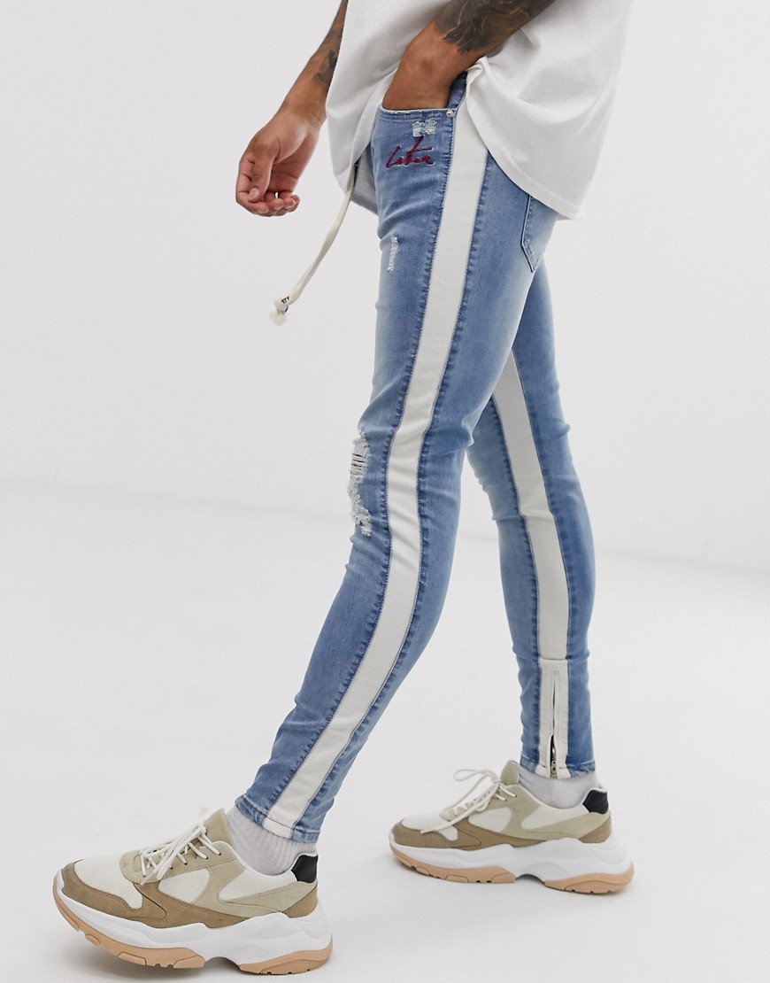 The Couture Club skinny jeans with rips in light wash blue