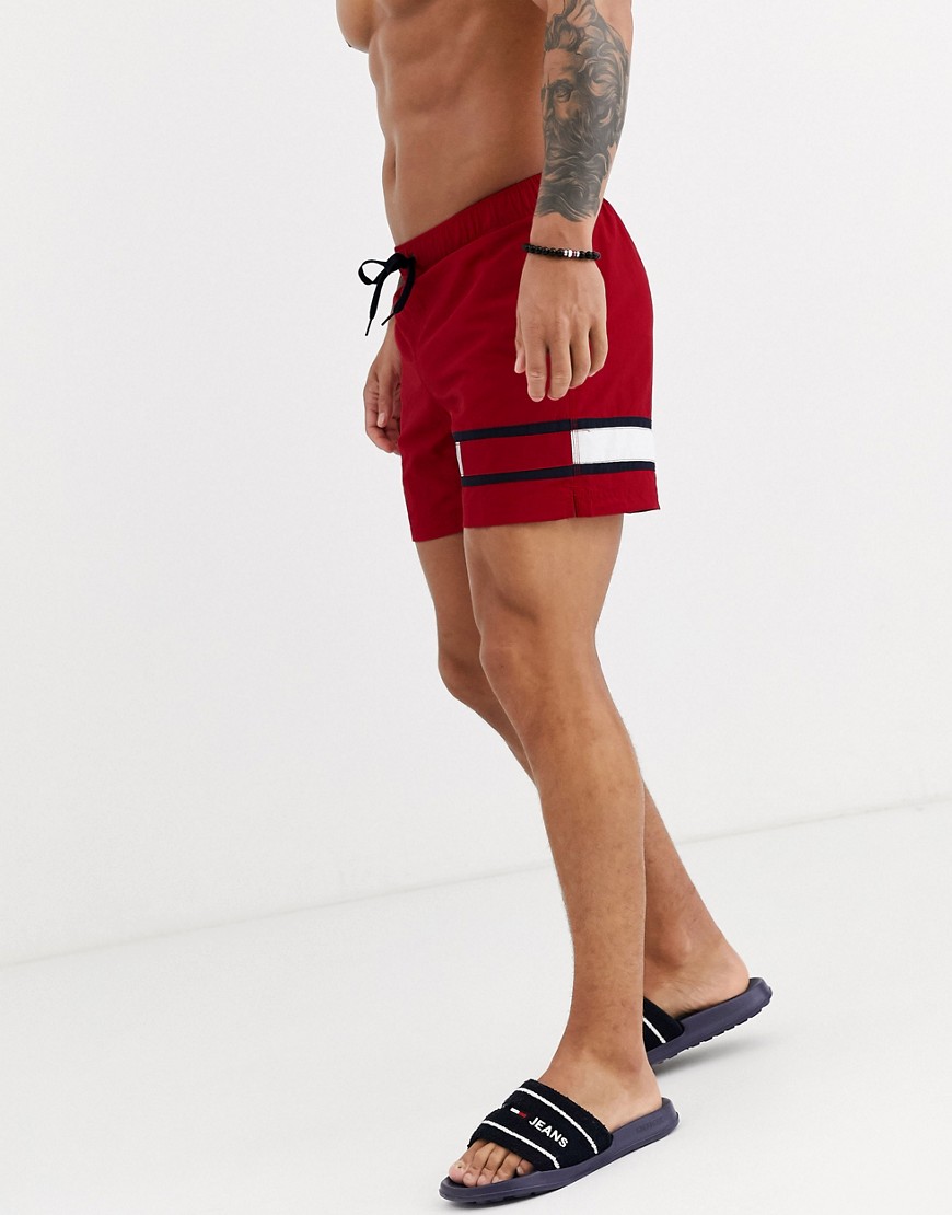 Tommy Hilfiger medium length flag logo swim shorts in red