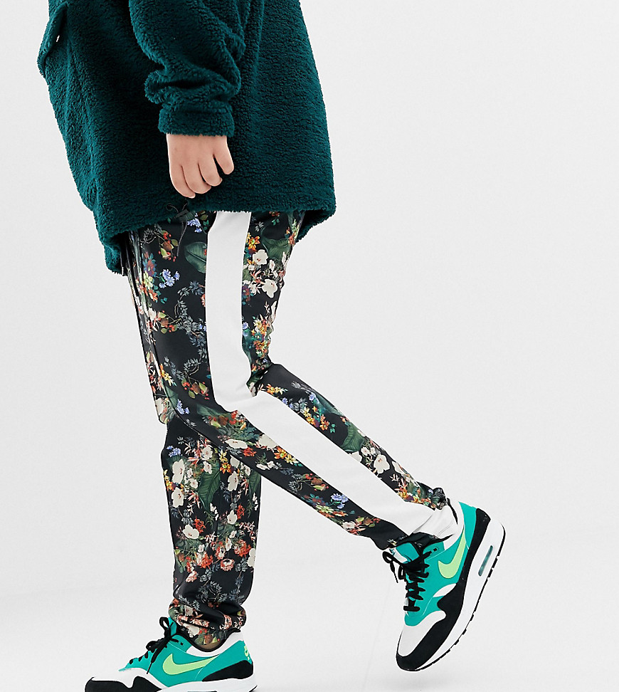 ASOS DESIGN Plus skinny joggers in retro track fabric with floral print and side stripes