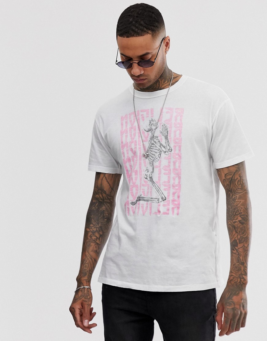 Religion t-shirt with pink skeleton text print in white