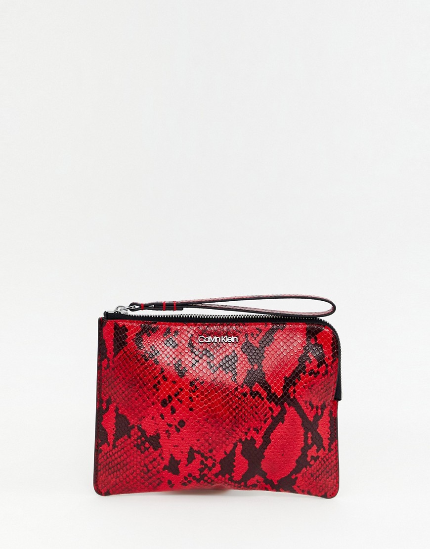 Calvin Klein zip around pouch in snake effect - Cherry