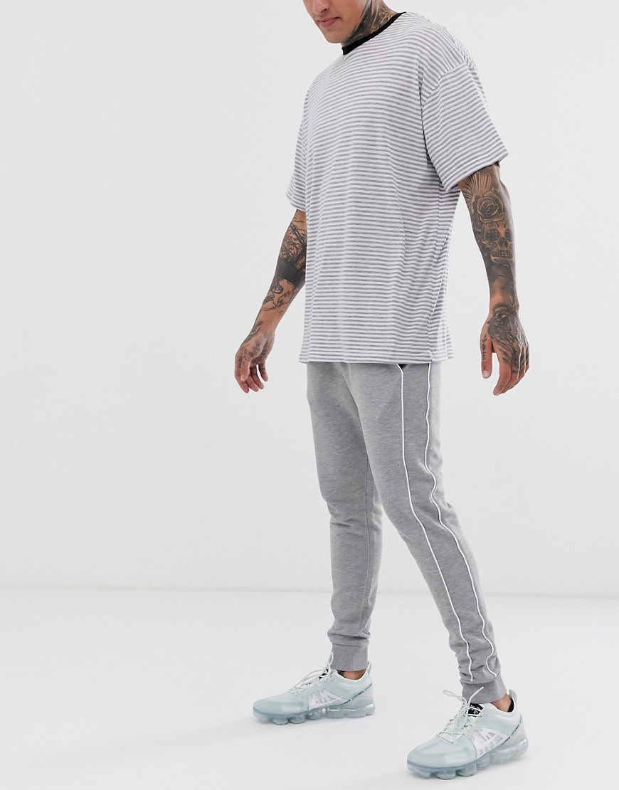 ASOS DESIGN skinny joggers with piping in grey marl