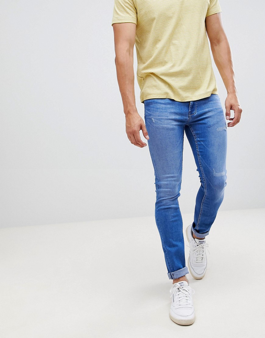 Burton Menswear jeans in skinny fit in mid blue wash