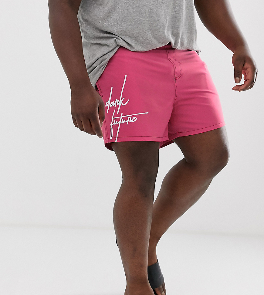 ASOS Design Dark Future Plus swim short in pink with branding short length