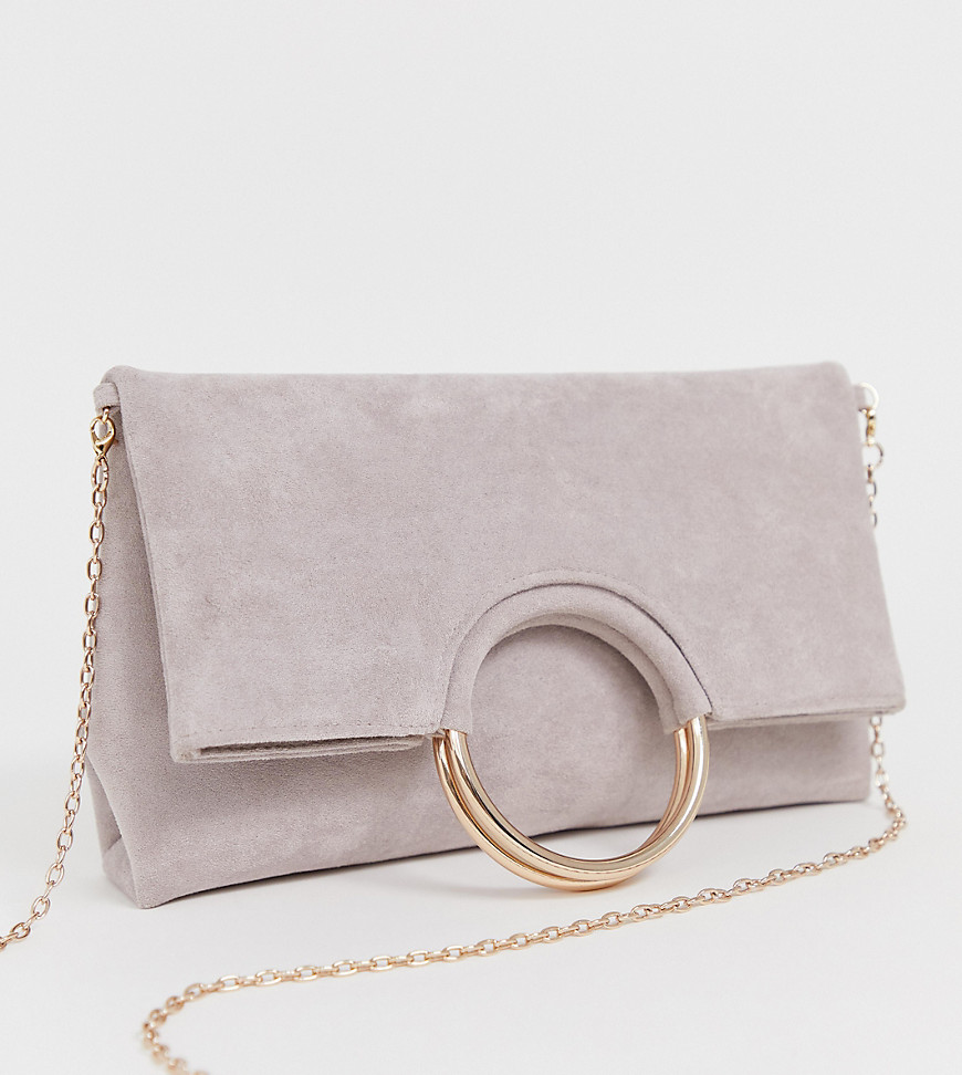 Accessorize foldover pink clutch with metal handle detail and removable chain strap