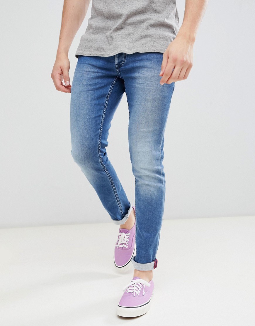 Solid stretch slim jean with crinkle effect in blue