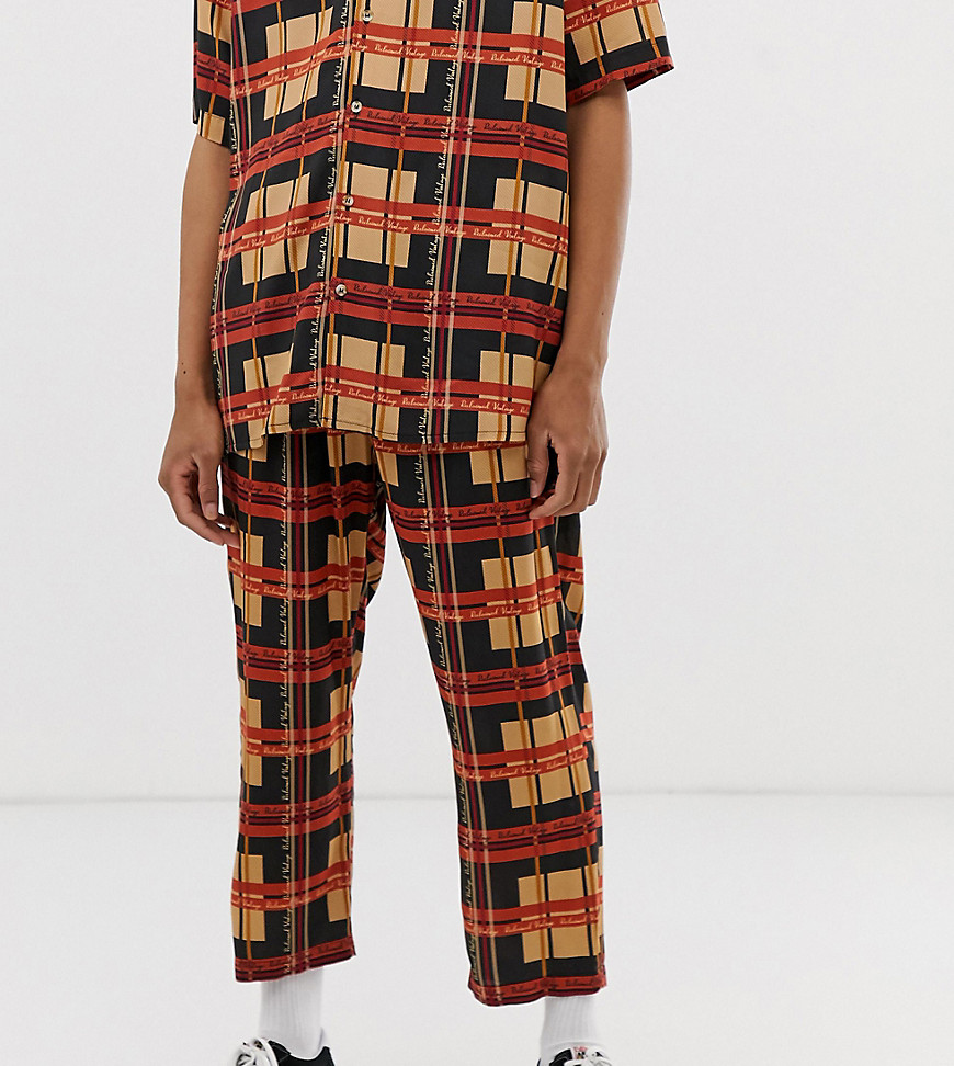 Reclaimed Vintage inspired branded check print trousers