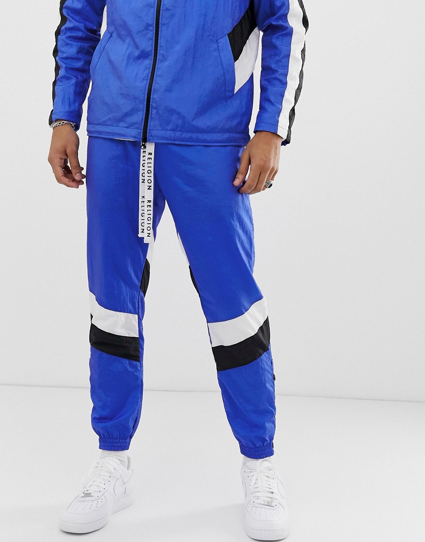 Religion tracksuit joggers in blue