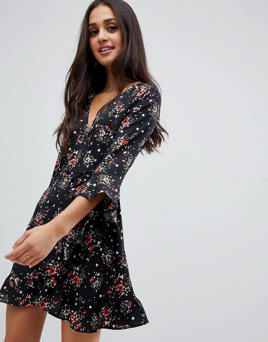 Influence floral and star print ruffle detail wrap dress