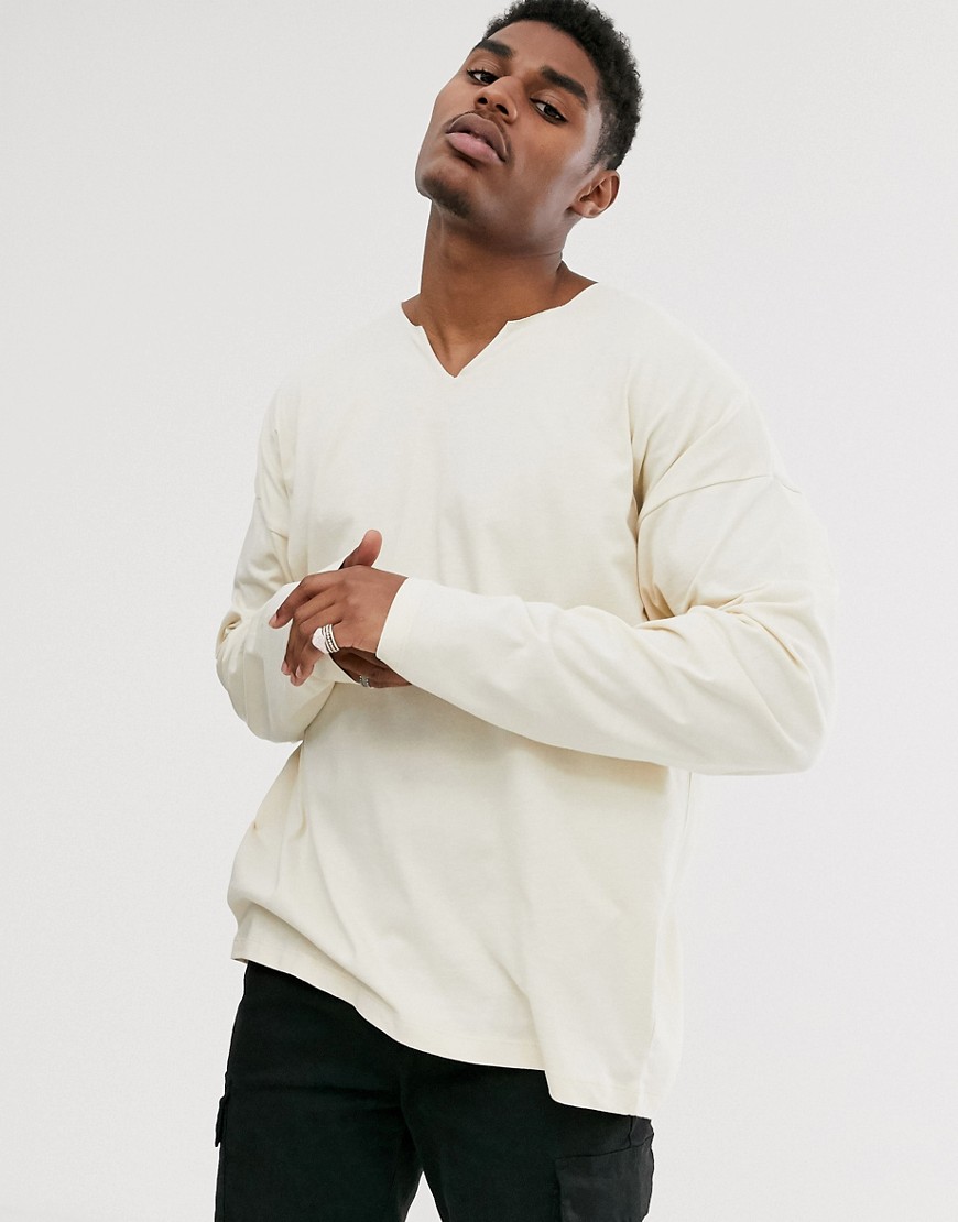 ASOS DESIGN oversized long sleeve t-shirt with raw notch neck in beige