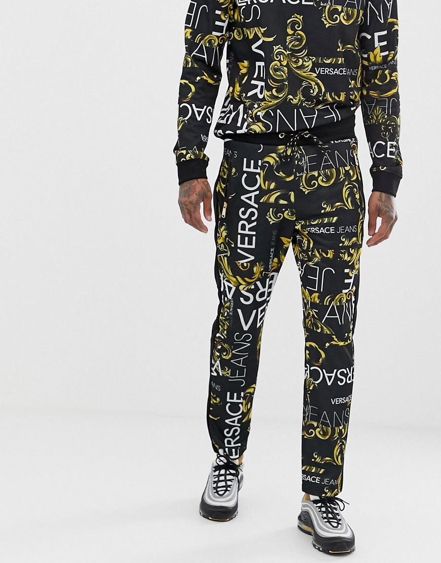 Versace Jeans skinny joggers in black with all over logo print