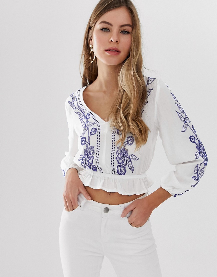 Parisian cropped wrap front embroidered blouse with peplum hem