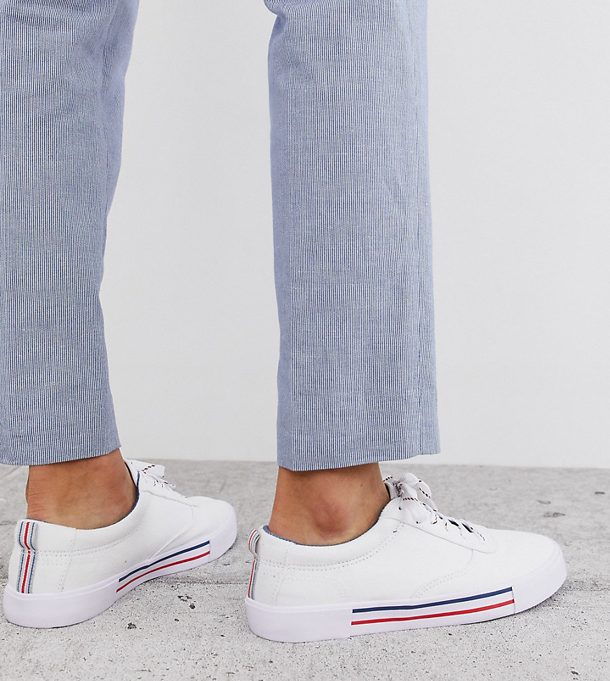 ASOS DESIGN Wide Fit lace up plimsolls in white with navy and red detailing