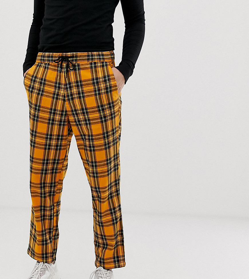 COLLUSION tapered fit check trouser in orange