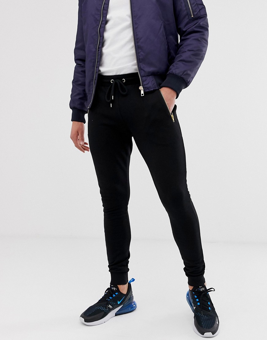ASOS DESIGN super skinny joggers with gold zips in black