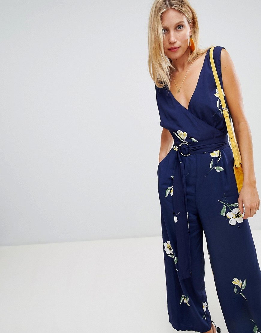 Warehouse floral wrap front jumpsuit with ring belt in navy